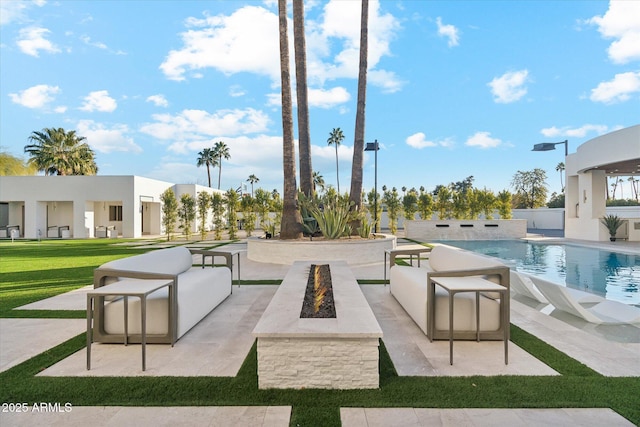 exterior space featuring a fire pit and a patio