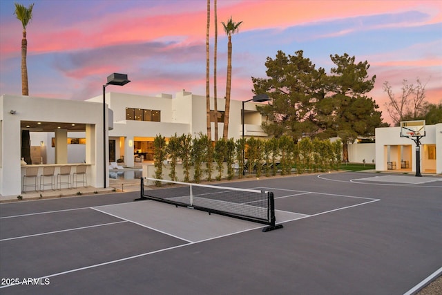 view of sport court with basketball hoop