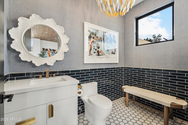 bathroom with tile patterned floors, vanity, and toilet