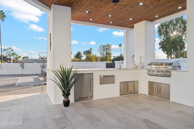 view of patio / terrace with sink, exterior kitchen, and area for grilling