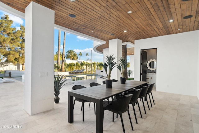 dining space featuring wood ceiling