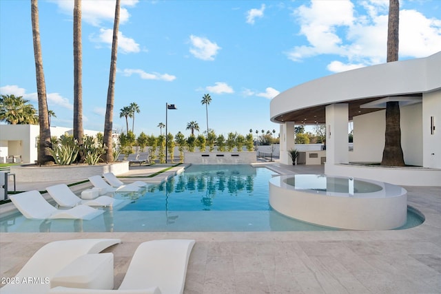 view of swimming pool featuring a patio area