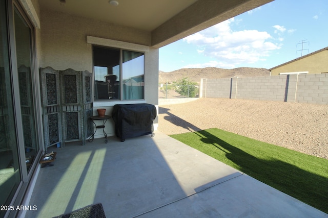 4923 W Weeping Willow Way, Laveen, AZ 85339 - fenced backyard featuring a patio area, a mountain view, and area for grilling