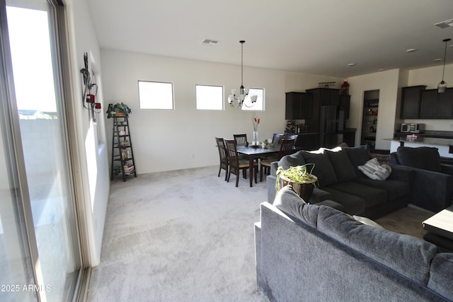 4923 W Weeping Willow Way, Laveen, AZ 85339 - living room featuring a chandelier and light carpet