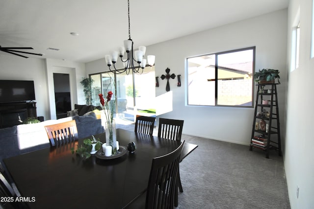 4923 W Weeping Willow Way, Laveen, AZ 85339 - dining area with a chandelier, carpet floors, and plenty of natural light