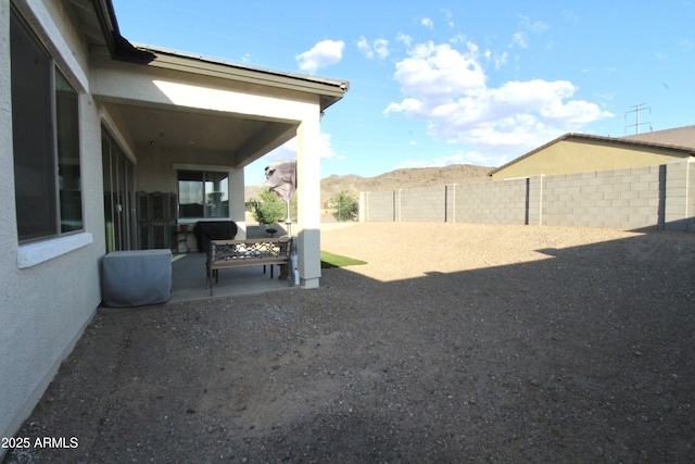 4923 W Weeping Willow Way, Laveen, AZ 85339 - fenced backyard with a patio and a mountain view