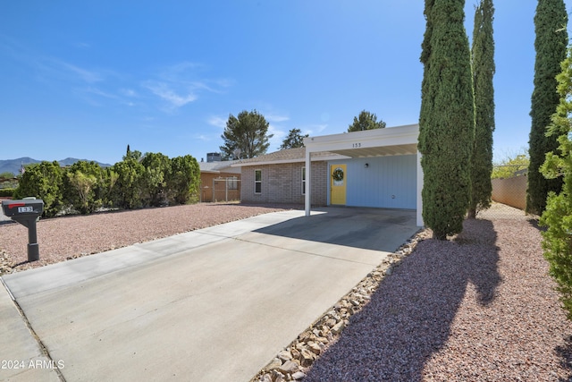 ranch-style house with a carport