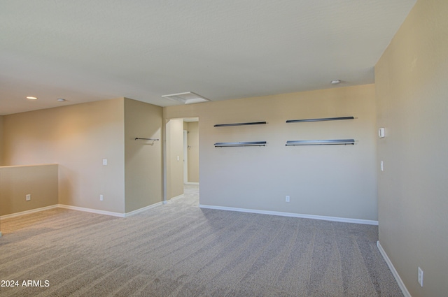 empty room featuring light colored carpet