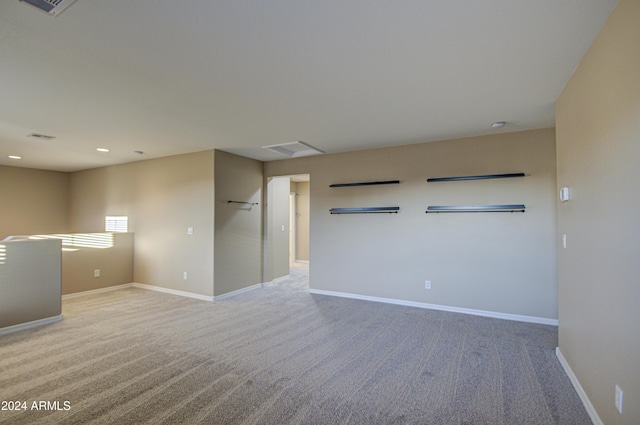 empty room with light colored carpet