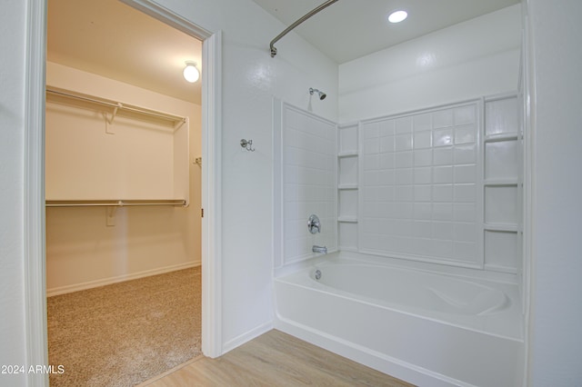 bathroom featuring shower / tub combination and hardwood / wood-style flooring