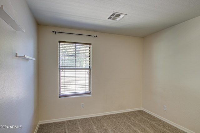 unfurnished room with carpet