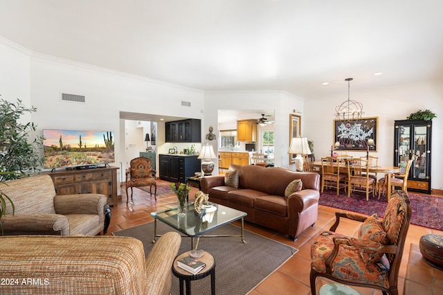 tiled living room featuring crown molding and ceiling fan