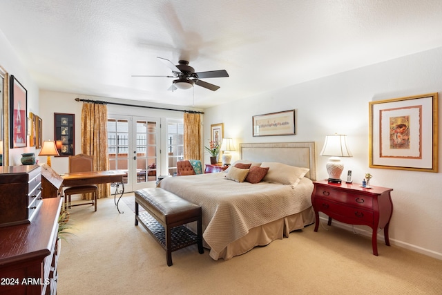 bedroom with light carpet, french doors, access to exterior, and ceiling fan