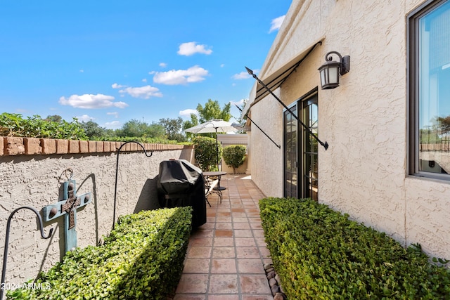 view of side of home featuring a patio