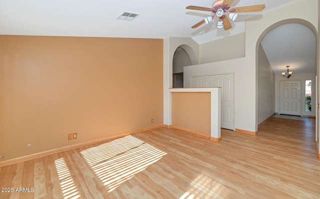 unfurnished room with light hardwood / wood-style floors, ceiling fan, and lofted ceiling