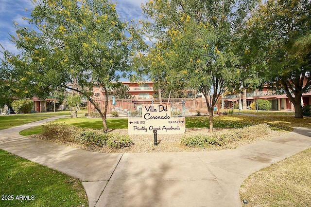 view of property's community with a yard