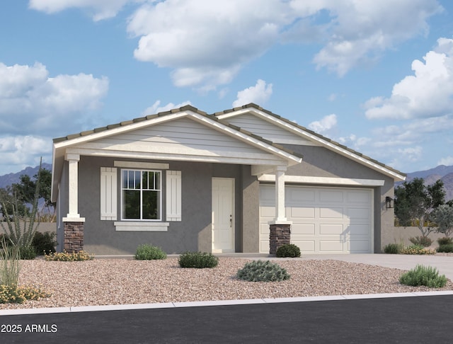 view of front of property with a mountain view and a garage