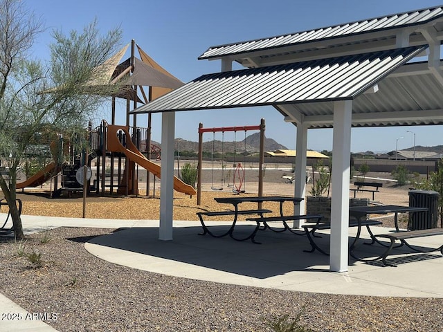 view of jungle gym with a mountain view