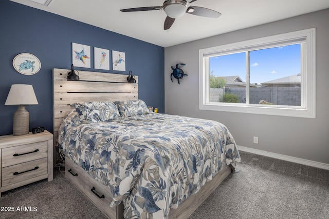 bedroom featuring baseboards, dark colored carpet, and a ceiling fan