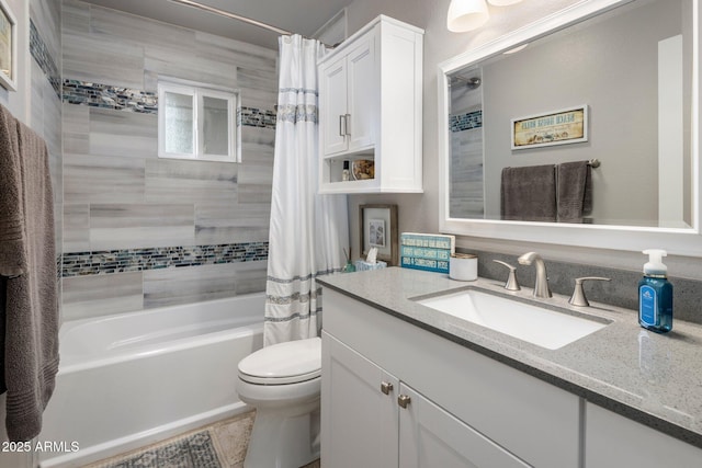 bathroom featuring shower / bath combo, vanity, and toilet