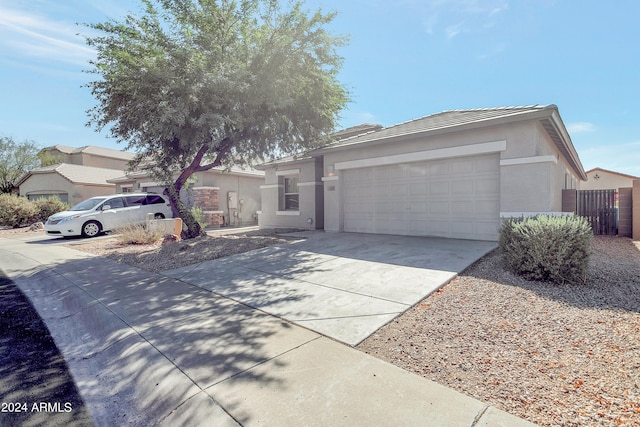 ranch-style home featuring a garage