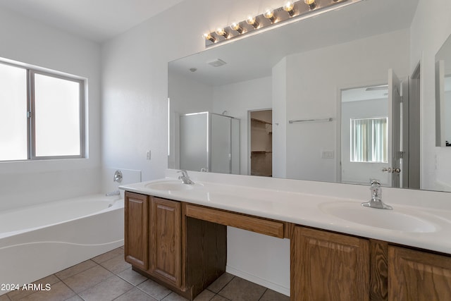 bathroom with independent shower and bath, vanity, and tile patterned floors