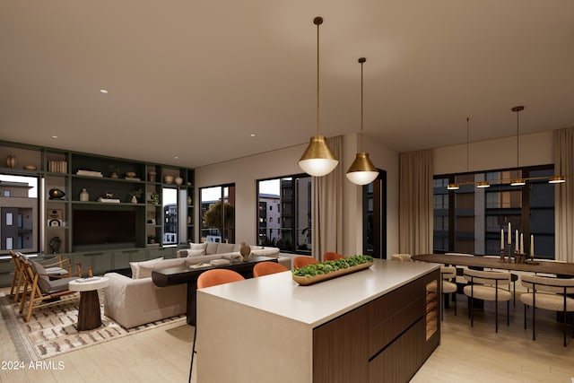 19360 N 73rd St Unit 1054, Scottsdale, AZ 85255 - kitchen featuring light wood finished floors, modern cabinets, pendant lighting, and a kitchen island