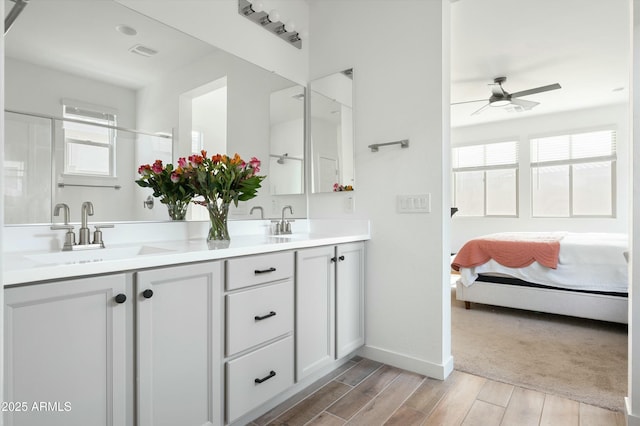 bathroom featuring ceiling fan and vanity