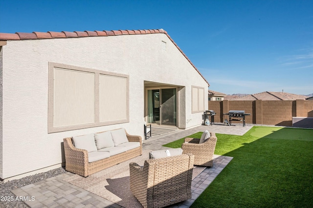 back of house with outdoor lounge area and a patio