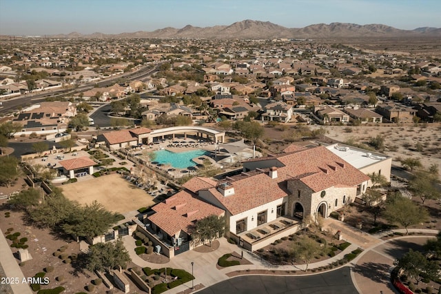 birds eye view of property with a mountain view