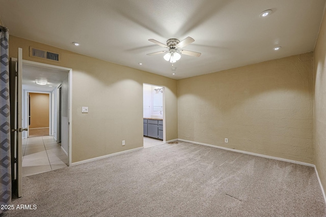 carpeted empty room with ceiling fan