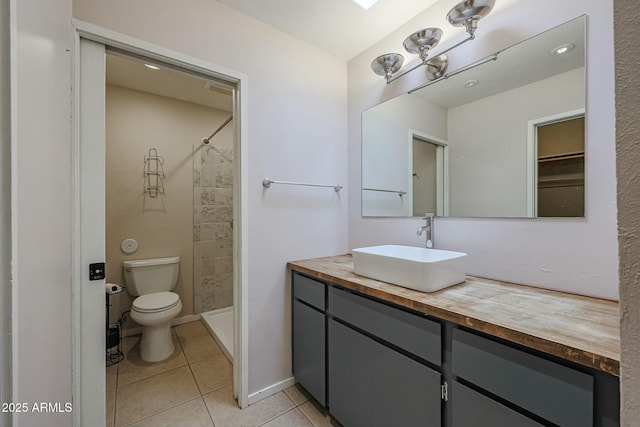 bathroom with walk in shower, tile patterned flooring, vanity, and toilet