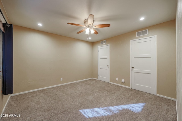 unfurnished bedroom featuring ceiling fan and carpet