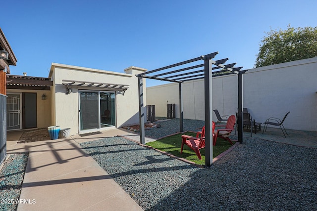 exterior space with a pergola and a patio