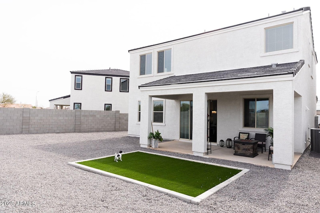 5924 S Daisy Patch Pl, Phoenix, AZ 85040 - rear view of property with a patio area, a fenced backyard, and stucco siding