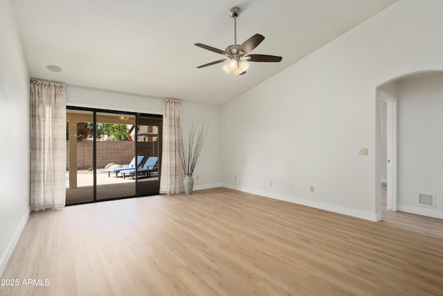 6366 W Saint John Ave, Glendale, AZ 85308 - unfurnished room with wood finished floors, arched walkways, ceiling fan, baseboards, and high vaulted ceiling