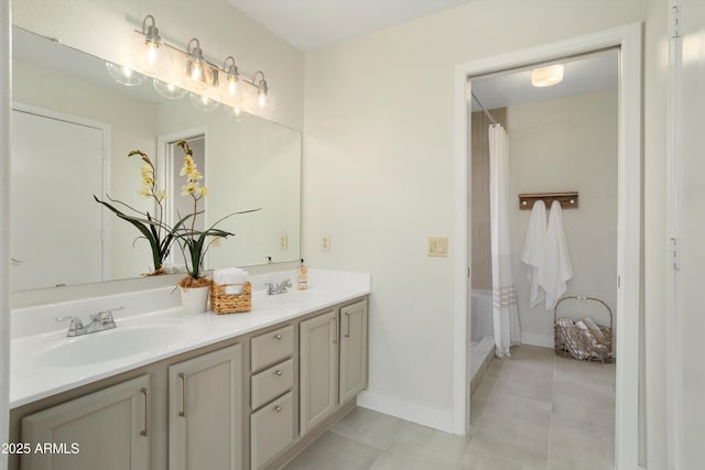 6366 W Saint John Ave, Glendale, AZ 85308 - bathroom with double vanity, baseboards, and tile patterned floors