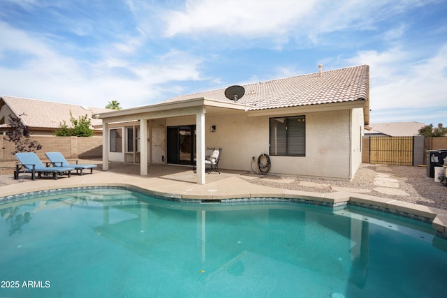 6366 W Saint John Ave, Glendale, AZ 85308 - rear view of house featuring a tile roof, stucco siding, a patio, and a fenced backyard