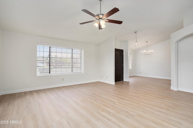 6366 W Saint John Ave, Glendale, AZ 85308 - empty room featuring a chandelier, lofted ceiling, light wood-style floors, ceiling fan, and baseboards