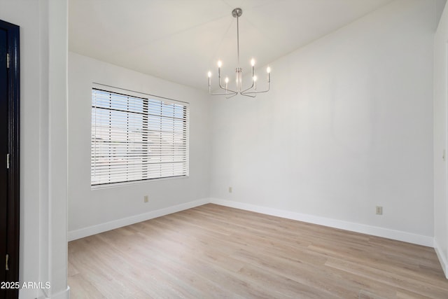 6366 W Saint John Ave, Glendale, AZ 85308 - empty room with a chandelier, light wood-style flooring, and baseboards
