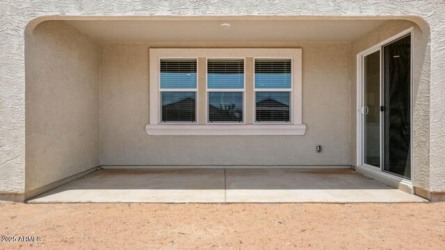 2640 W Stanton Ave, Apache Junction, AZ 85120 - entrance to property featuring stucco siding and a patio
