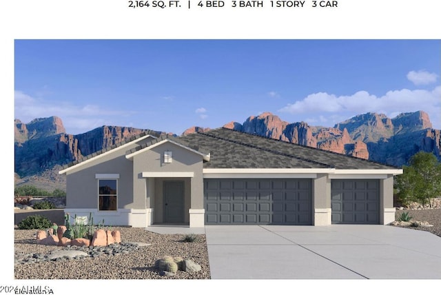 2640 W Stanton Ave, Apache Junction, AZ 85120 - view of front of house with an attached garage, driveway, a mountain view, and stucco siding