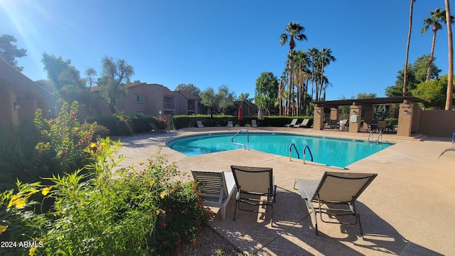 view of pool featuring a patio area