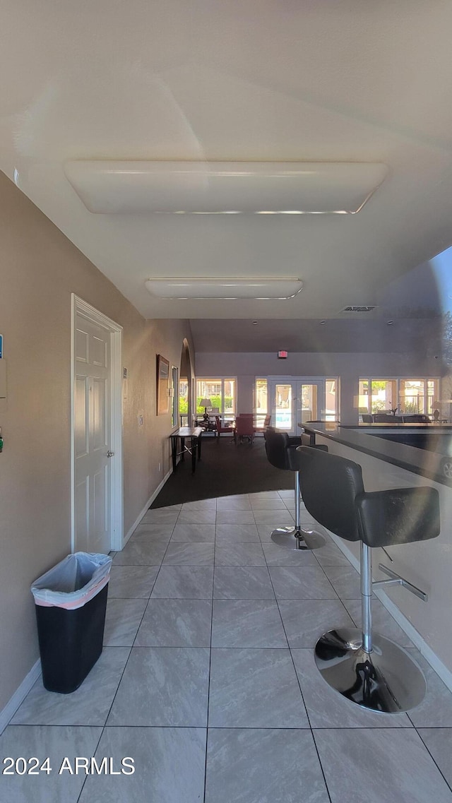 interior space with tile patterned floors