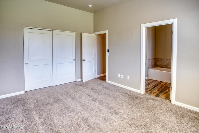 1028 W Ione Ln, Taylor, AZ 85939 - unfurnished bedroom with a closet, connected bathroom, baseboards, and carpet