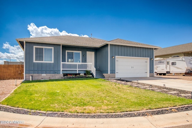 ranch-style home with a garage and a front lawn