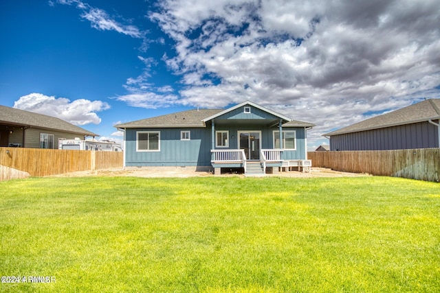 back of house with a yard