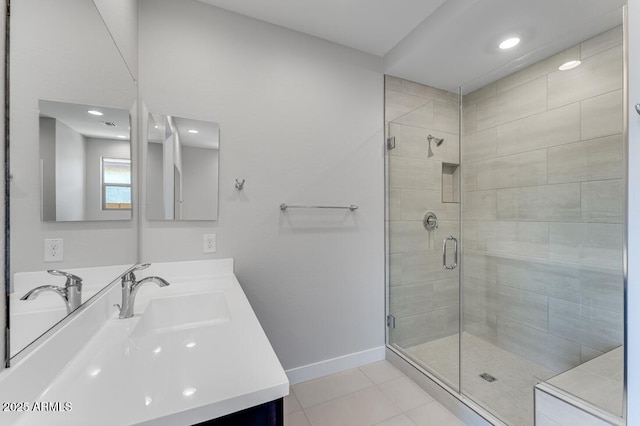 1301 W Via De Olivos, Queen Creek, AZ 85140 - full bathroom featuring baseboards, tile patterned flooring, double vanity, a shower stall, and recessed lighting
