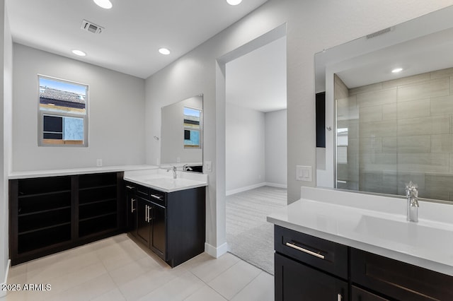 1301 W Via De Olivos, Queen Creek, AZ 85140 - bathroom featuring two vanities, recessed lighting, tile patterned floors, and baseboards