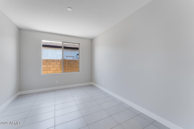 1301 W Via De Olivos, Queen Creek, AZ 85140 - spare room featuring light tile patterned floors and baseboards